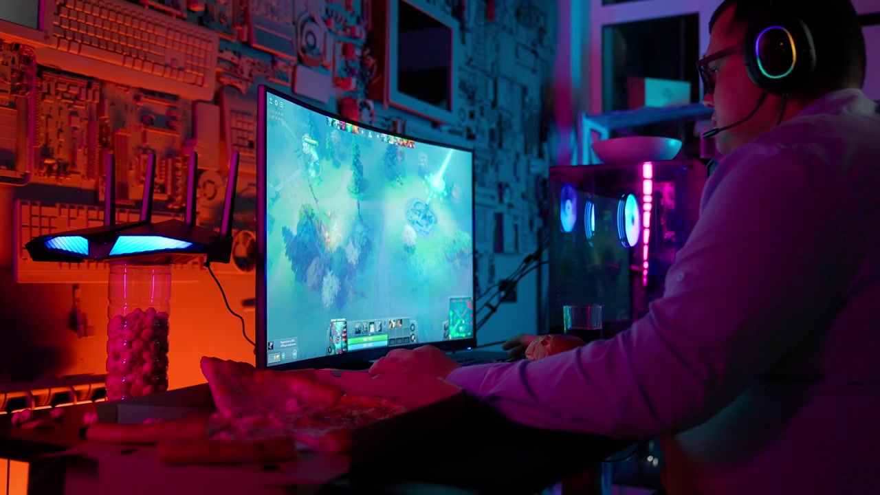Gamer Playing Online Video Game in Neon Lit Room