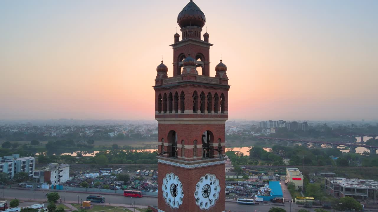 Aerial drone shot of Lucknow’s Clock Tower, with the sun rising behind it, creating a silhouette.