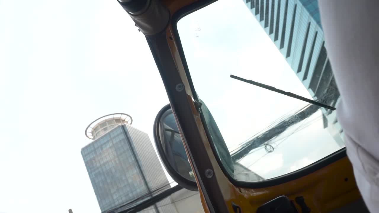 Riding with a "tuk tuk" on the way to work