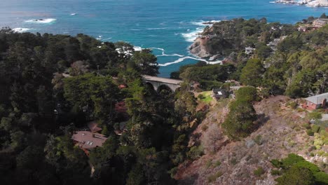 cars driving over bridge near carmel by the sea neighborhood