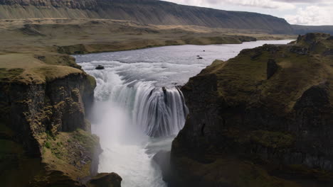 powerful waterfall in a scenic valley