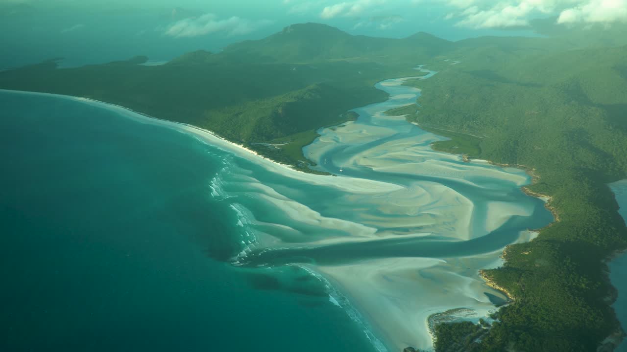 Famous Whitehaven beach inlet with pure white sand during morning golden hour