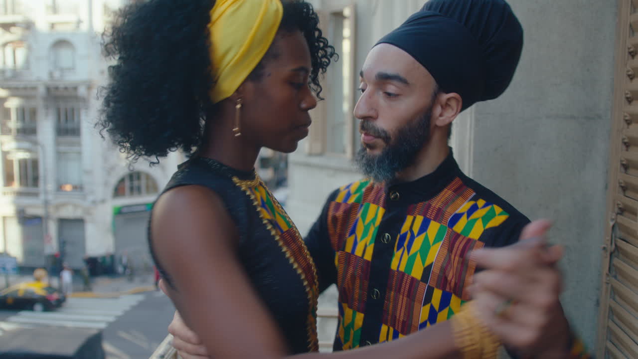 Artistic Dancers Performing Argentine Tango on a Balcony