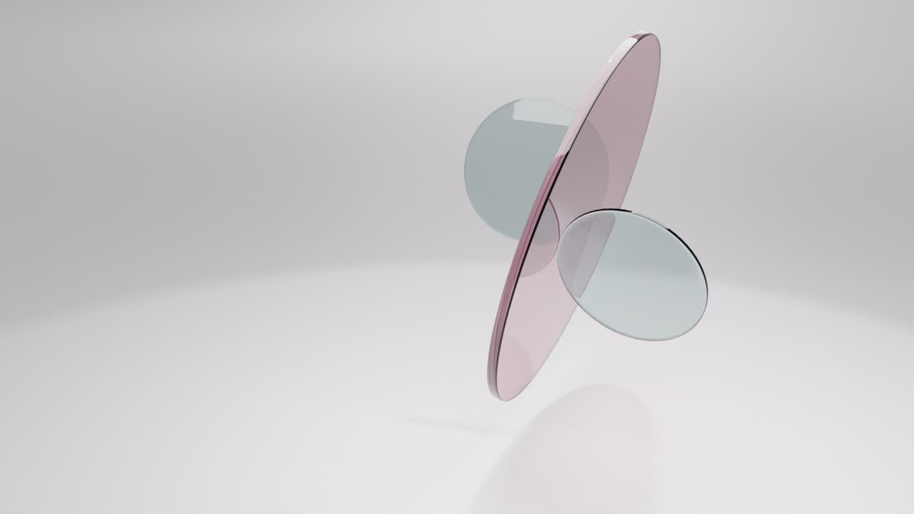 Translucent round glass lenses spinning and rotating on white background. Abstract background with copy space. 3D loop animation