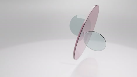 translucent round glass lenses spinning and rotating on white background. abstract background with copy space. 3d loop animation