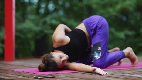 woman practicing yoga outdoors