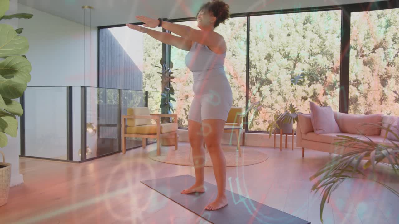 Woman starting half-squat doing squats on mat with watch, light streaks tracing motion for fitness