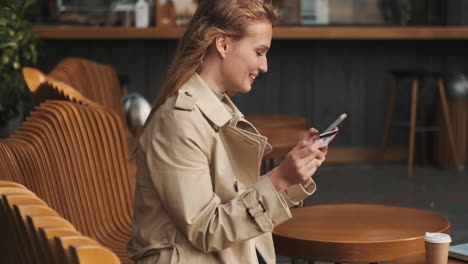 caucasian female student online shopping on smartphone outdoors.