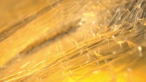 rack focusing from outer edge of bubble wrap bag, macro view of several air pockets