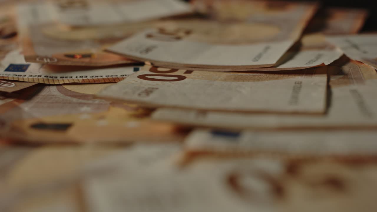 Large amount of cash with a lot of 50 euro bills scattered around