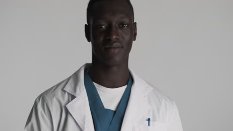 african american doctor on grey background.