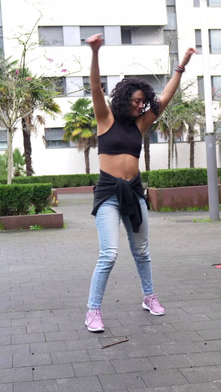 Woman dancing in an urban setting