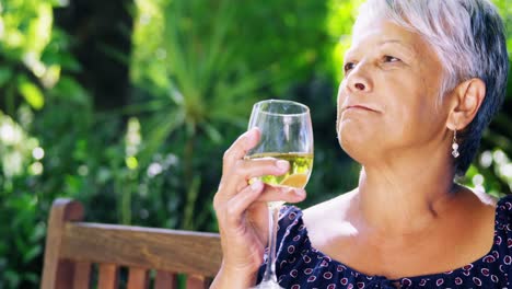 senior woman drinking wine