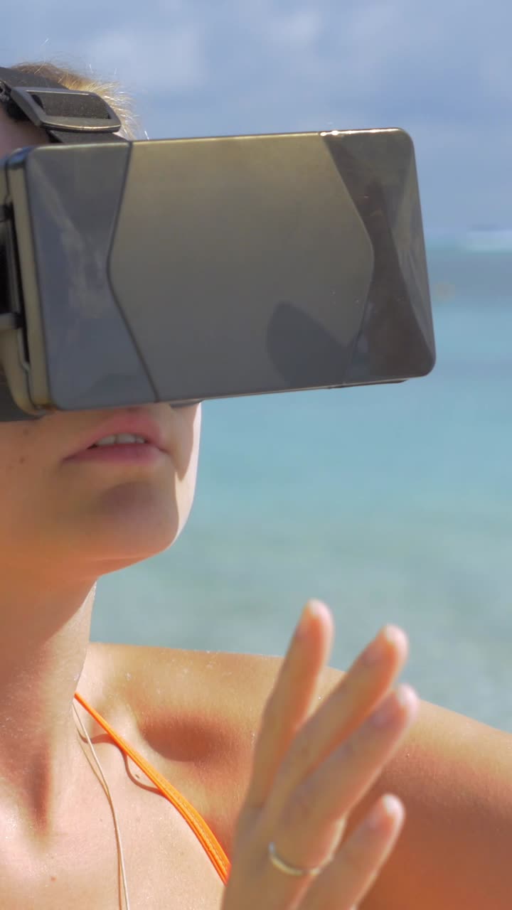 Young Woman Interacting with Virtual Reality Headset on Tropical Beach