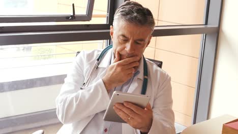 Doctor-using-digital-tablet-