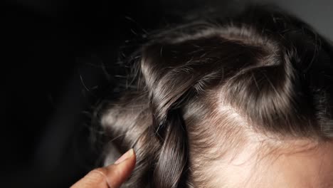 hairdresser curly dark hair in slow motion