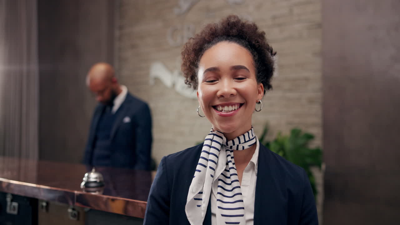 Hotel Receptionist Smiling at the Front Desk