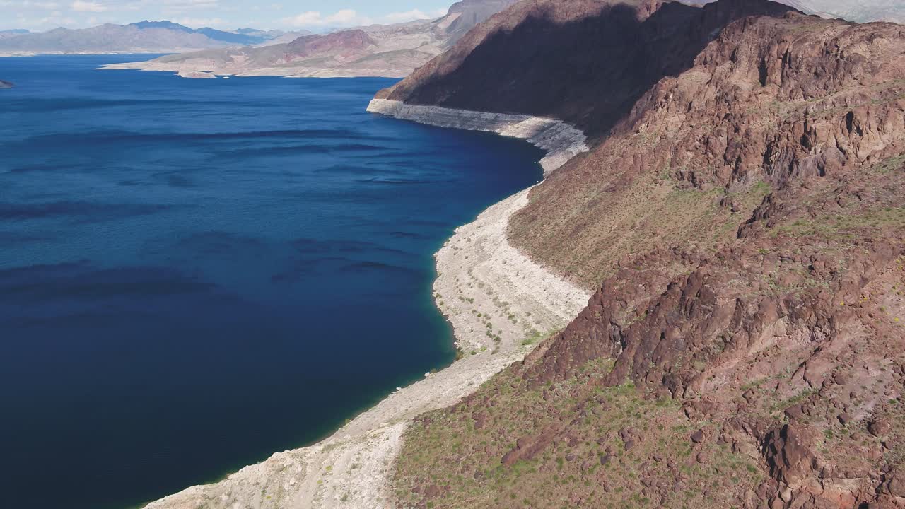 A high-flying drone shot over Lake Mead, a massive reservoir formed by the Hoover Dam on the Colorado River, that lies on the border of Arizona and Nevada, just east of Las Vegas