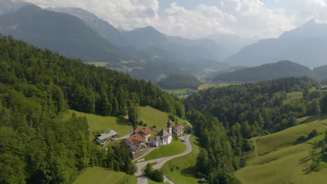 drone flies above maria gern church in bavaria, germany