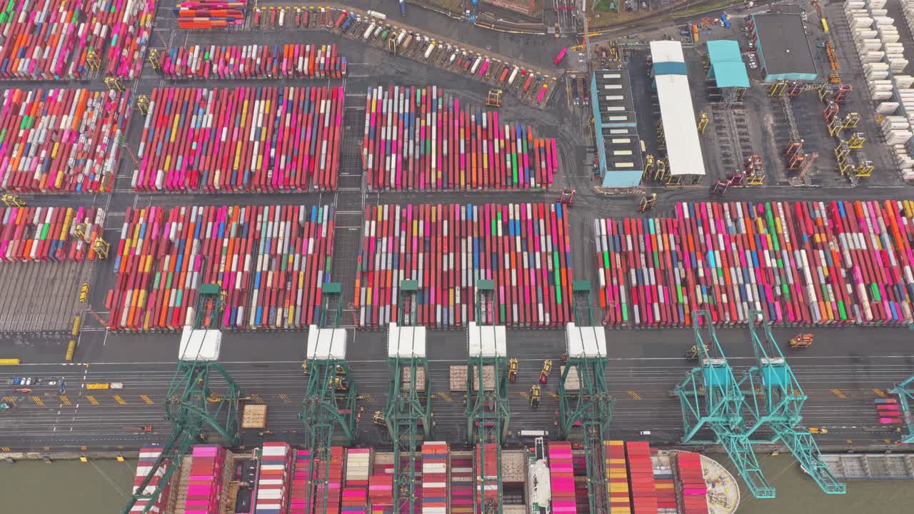 Antwerp port aerial view of containers, shipping cranes and vessels, Belgium