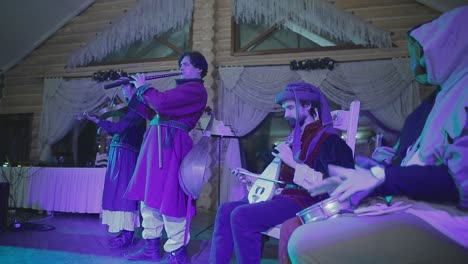 medieval quartet playing indoor. vinnitsa, ukraine, march 2017: medieval quartet playing music instruments, indoors