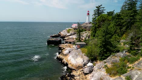 aerial pan of lighthouse park coastline and lighthouse, vancouver, bc, canada