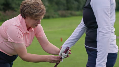 women playing golf