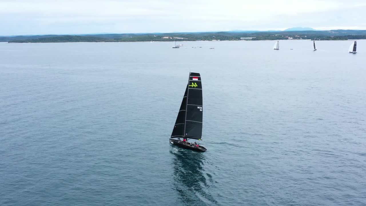 Race Sailboat sailing in Regatta RC44 Rovinj Croatia - Aerial Drone View