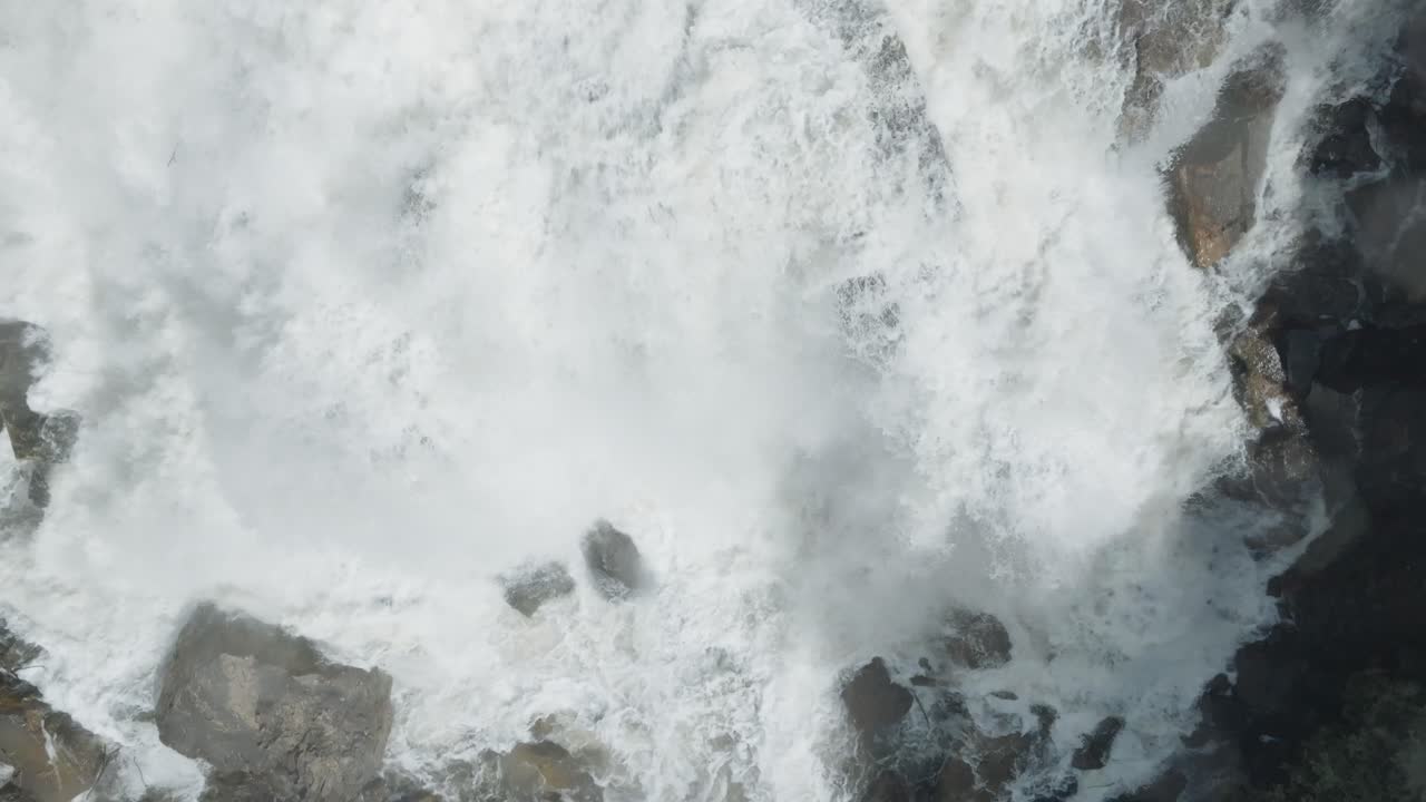 Majestic waterfall in Owen Sound, Canada, cascading down rocks with powerful force