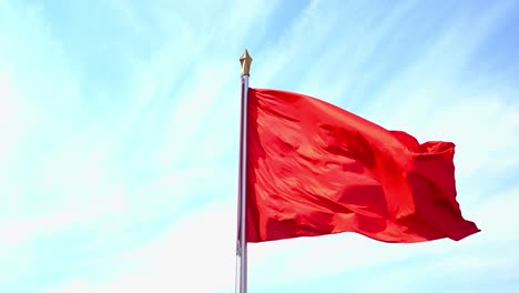 red flag waving on the wind