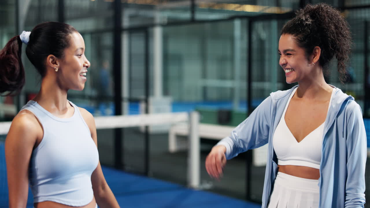 Two smiling women after padel match