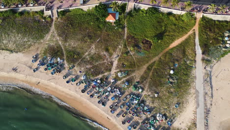 aerial top down, traditional coracle vietnamese fishing boats on beach shore