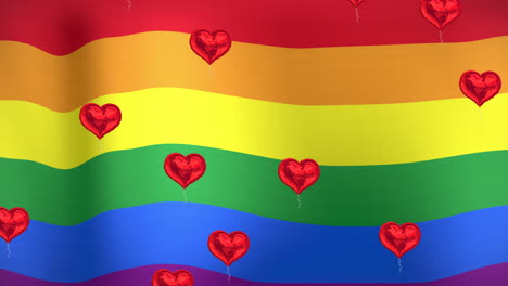 animación de corazones flotando sobre la bandera del arco iris