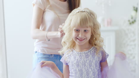 a young lady is doing an elegant hairstyle