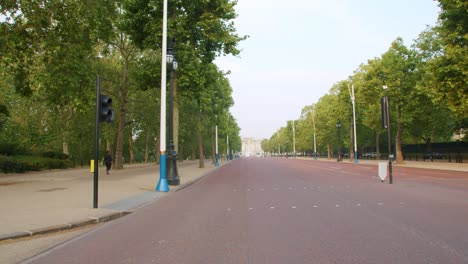 lockdown in london, slow motion gimbal walk along desolate buckingham palace streets, during the coronavirus pandemic 2020