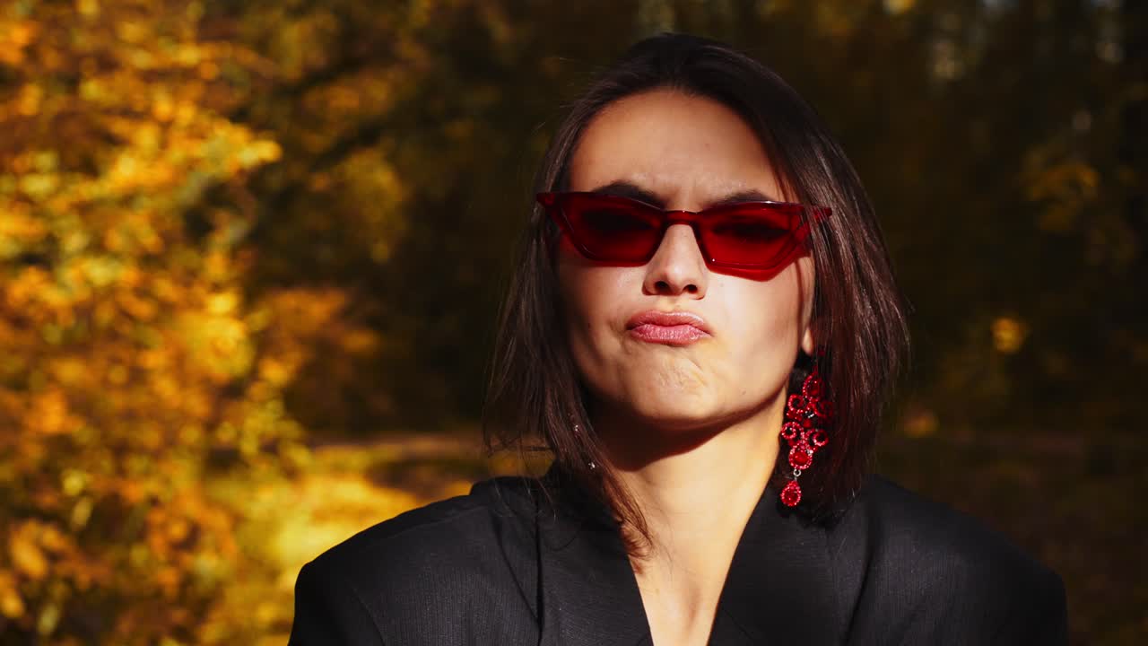 A Stylish Individual Showcases Bold Fashion Choices with Statement Accessories, Capturing the Essence of Autumn with Vibrant Colors and Unique Expression