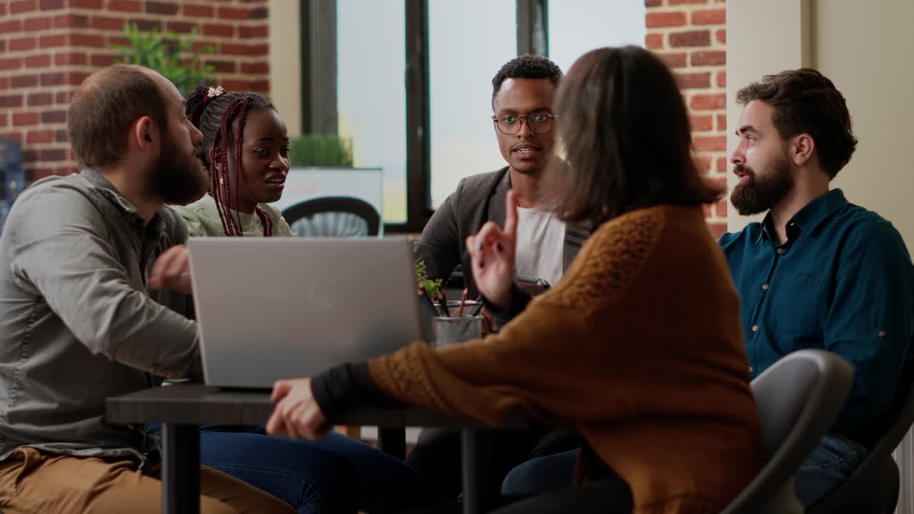 Diverse team of business people brainstorming ideas to plan research project