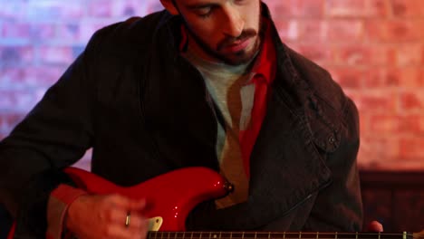 handsome musician playing guitar