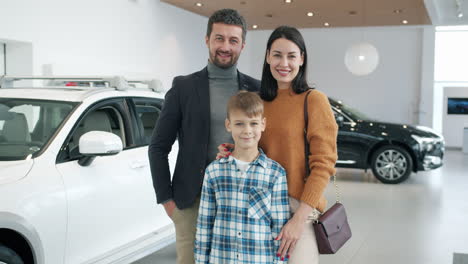 happy family at car dealership