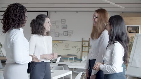 professional content businesswomen talking in office