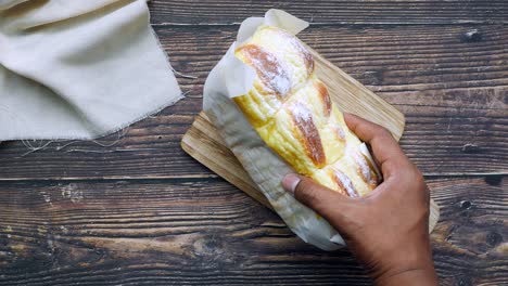 Close-up-of-cream-bun-bread-on-table-,