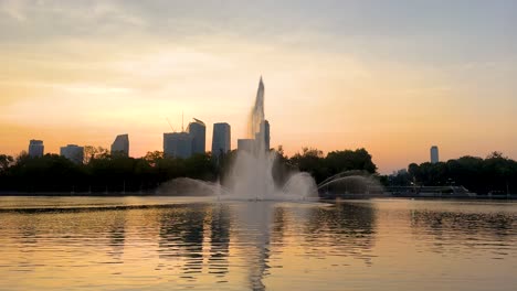 sunset fountain in the city park