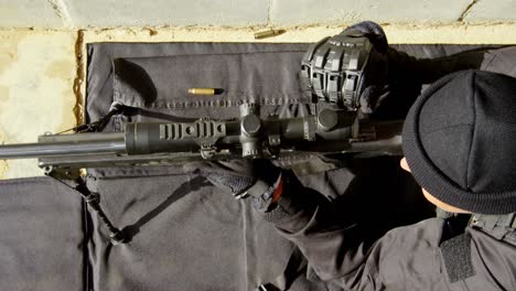 high angle view of caucasian military soldiers firing rifle during training at military base 4k