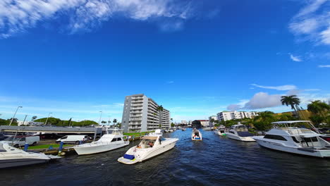 yachts sailing by the river in american city. yacht club in the big city. aerial perspective from fpv drone.