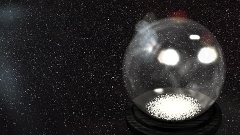 animation of snow falling over christmas snow globe on black background