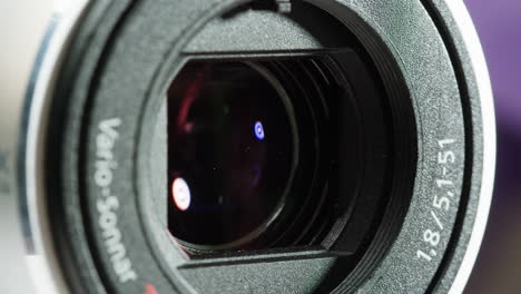 close-up of vintage video-camera. close and open lens zoom of camera. using portable camcorder to shooting videos