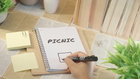 ticking off picnic work from checklist