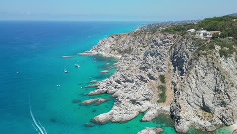 capo vaticano cliff, lighthouse, blue mediterranean sea and coastline of calabria, south italy - aerial 4k