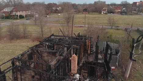 drone view of dilapidated house in a detroit neighborhood