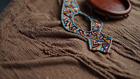 beaded necklace and hand drum